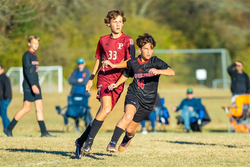 Middle school students play soccer